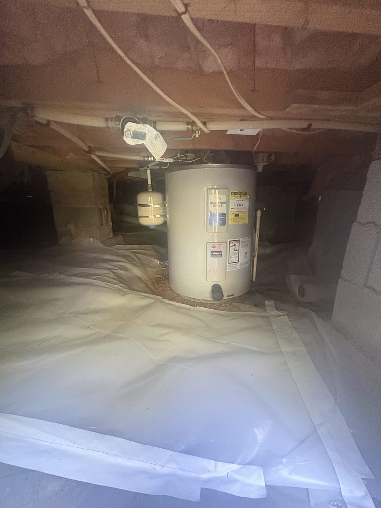 AFTER — vapor barrier repaired and the crawlspace cleaned up | Repaired crawlspace vapor barrier around a new water heater installed by ARC Plumbing in Angier, NC |