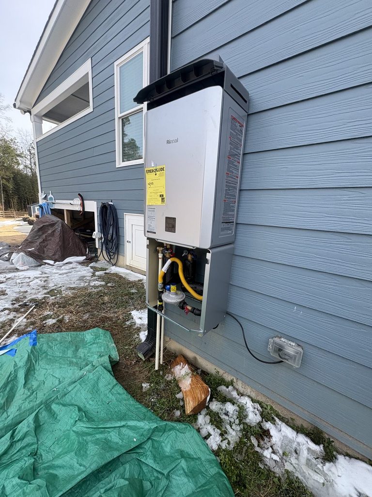 DURING — Rinnai RXP199 hung and connected | Rinnai RXP199 tankless water heater being installed by ARC Plumbing in Angier, NC |
