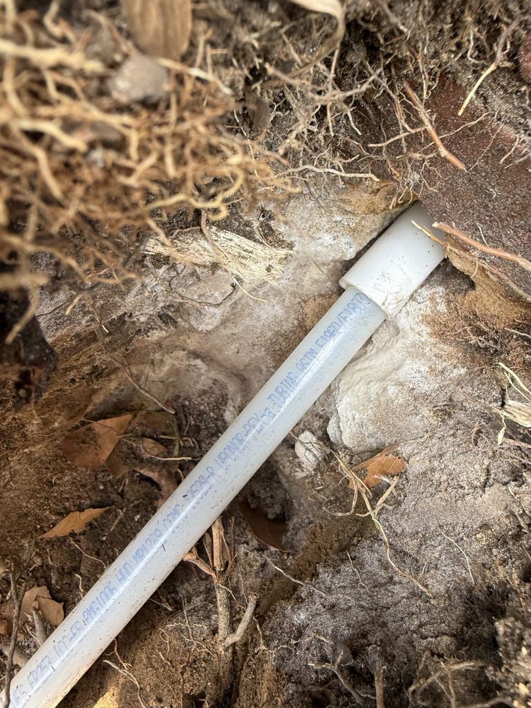DETAIL — line sleeved through the foundation into the crawlspace | New water line sleeved through the foundation into a crawlspace in Raleigh, NC