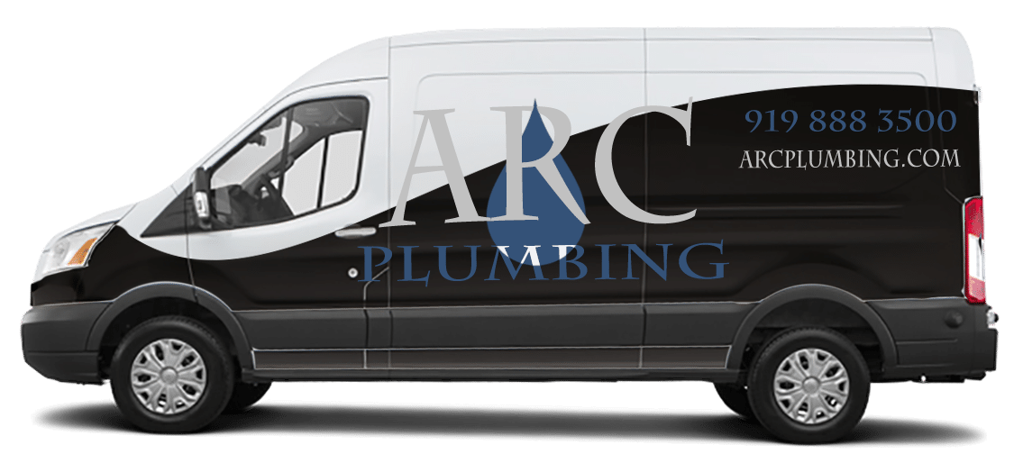 ARC Plumbing work van with the black-and-white ARC wrap, phone number and arcplumbing.com on the side